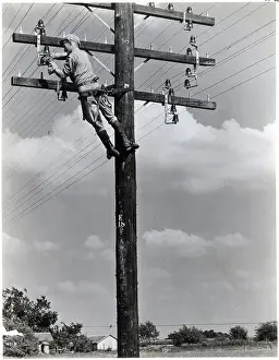 Pole Prints: Telephone Worker up a Pole Working