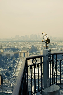 Railing Collection: Telescope overlooking city skyline