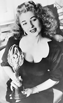 Tempest Storm Holding Her Mickey Award