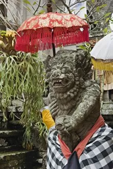 Parasol Gallery: Temple guardian, decorated stone figure, Pura Desa Temple, Ubud, Bali, Indonesia