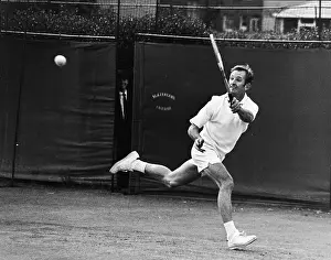 Prints of Australian tennis ace Rod Laver in tennis whites returns a shot during a practice session at the London Open Grass Court Championships, London, June 20, 1969 The Grand Slam Gallery: Tennis Great Rod Laver