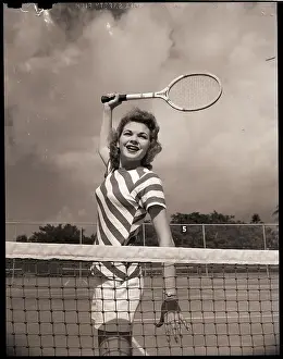 Tennis Player with Racket Up