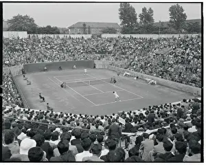 Tennis Players Competing in Match