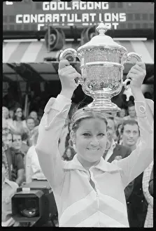 Chris Evert Prints: Tennis Star Chris Evert Holding Large Trophy Overhead