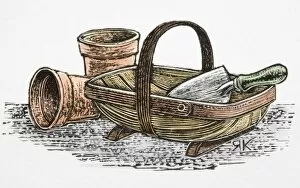 Two terracotta plant pots, and hand trowel in trug