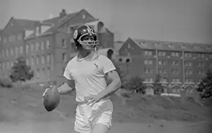 Terry Bradshaw Holding Football on Field During Pittsburgh Strike
