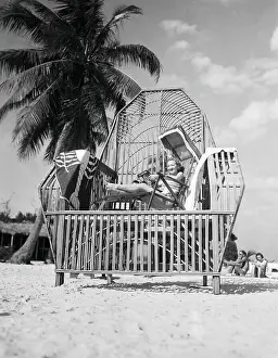 Sunbathing Prints: Tez Jackson Sitting in a Large Reed Chair