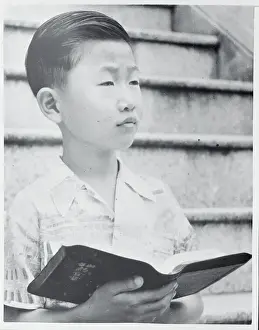 Thai Child Reading the Bible