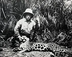 Prints of (Original Caption) 1913-Theodore Roosevelt kneeling beside a slain jaguar during hunt on the Rio Taquari, Brazil A Legacy in Images: Theodore Roosevelt with Slain Jaguar