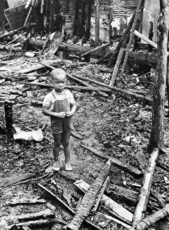 Thomas Allens Stands in Ruins of his Home