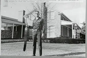 Arkansas Prints: Thomas C. Murton Holding a Strap Outside his Home