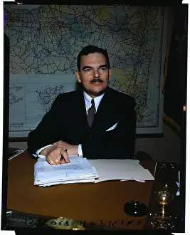 Thomas E Prints: Thomas E. Dewey Sitting at Desk