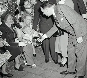 Thomas E Prints: Thomas E Dewey Trying to Appease Crying Child