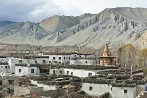 Tibetan architecture, houses with flat roofs, erosion in the mountains, typical stupa in the village Charang