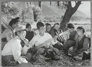 Stringed Instrument Prints: Tibetan Farmer Playing Musical Instrument for Others