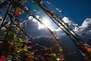 Tibetan prayer flags and snow mountain in China