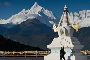 Tibetan stupa and snowy Meili Xue Shan peak