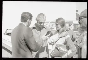 Psychologist Prints: Timothy Leary and Wife Being Greeted by Police Detective