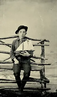 Time Captured: Vintage Art: Tintype photograph from 1870s of boy holding a model sailboat