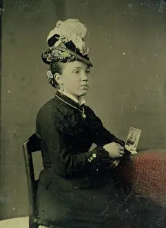 Time Captured: Vintage Art: Tintype of woman in feathered hat holding a photograph