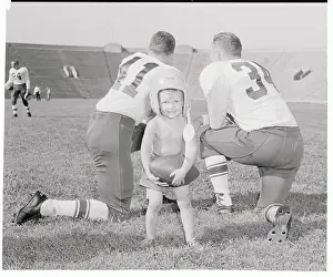 Lawrence Prints: Toddler with Football Helmet