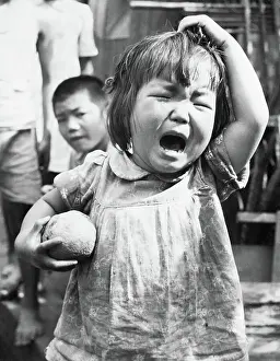 Toddler with Orange Crying