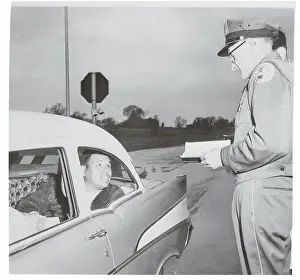 Syracuse Prints: Toll Taker Conversing with Native American Activist in Automobile