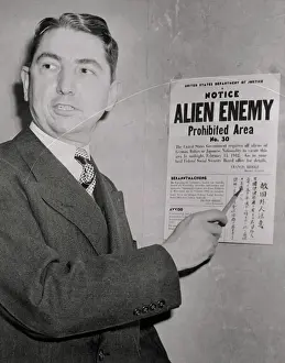 Tom Clark Pointing at Warning Card