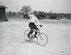 Tom Mix Riding Bicycle