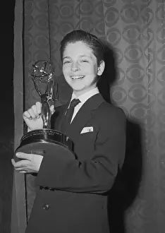 Tommy Reddick Holds Emmy Award
