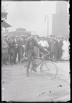 Recruiting Prints: Tony Pizzo on Bicycle near Spectators