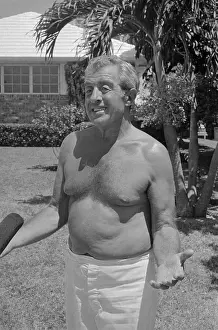 Tony Pro Walking on Lawn Wrapped in a Towel