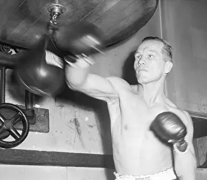 Gymnasium Prints: Tony Zale Punching Small Bag At Gym