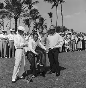 Torakici Nakamura Pretending to Break Sam Snead's Golf Club
