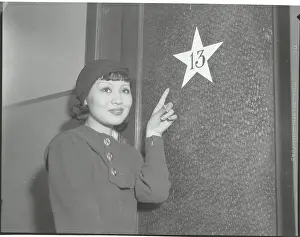 Luck Prints: Toshia Mori Pointing to Dressing Room Number