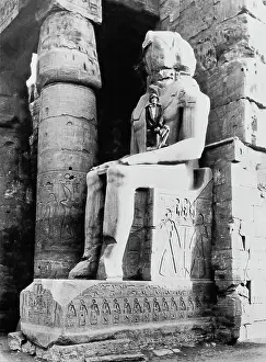 J1692868 Prints: Tourist Poses On Statue