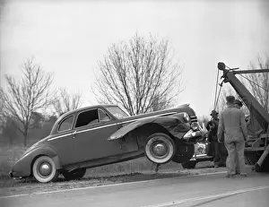 Wreck Prints: Tow truck lifting broken car, (B&W)