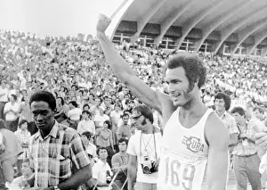 Sofia Prints: Track Star Alberto Juantoreena Raising His Hand at Ceremonies
