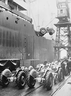 Tractor Prints: Tractors Being Loaded onto Boat