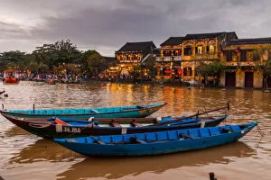 Images Dated 9th December 2017: Traditional boats in front of ancient architecture in Hoi An, Vietnam