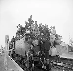 Fleeing Prints: Train Loaded With People Arriving At Dep