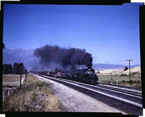 Train Passing Through Near Mountain Area