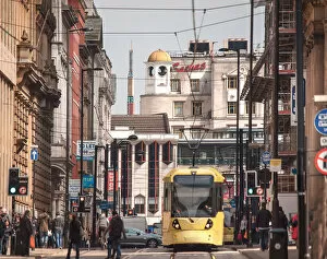 Images Dated 25th June 2015: A tram leaving Piccadilly Gardens, Manchester