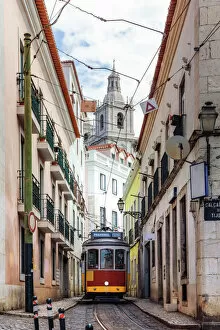 Perfect Puzzles Gallery: Tram in a narrow street in the old town, Lisbon, Portugal