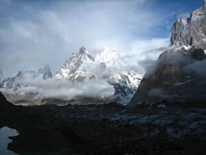 Trango towers and Thunmo Cathedral under clouds