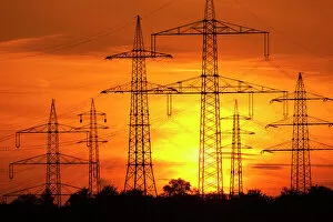 Silhouette Gallery: Transmission lines, overhead line towers, with setting sun, Beinstein in Stuttgart