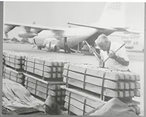 Zambia Prints: Transportation Worker Clipping Together Copper Transports