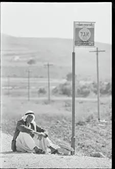 Traveler Waiting for Bus at Stop