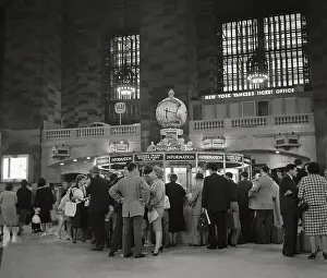 Travelers standing Near Grand Central Information Booth