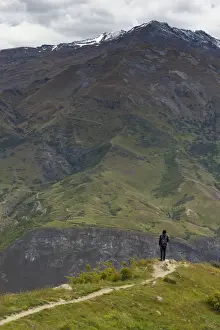 traveller looking at mountain in Queenstown, New Zealand